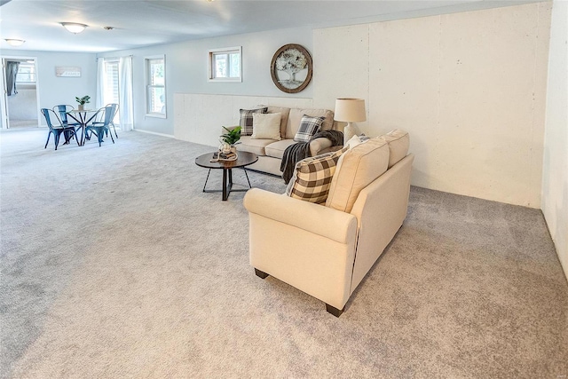 living room featuring light carpet