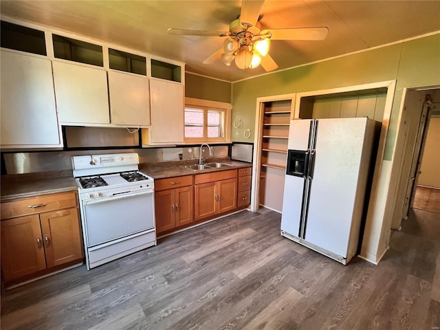 kitchen with sink, ceiling fan, white appliances, and dark hardwood / wood-style flooring