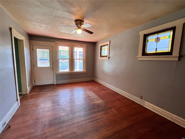 empty room with ceiling fan and wood-type flooring