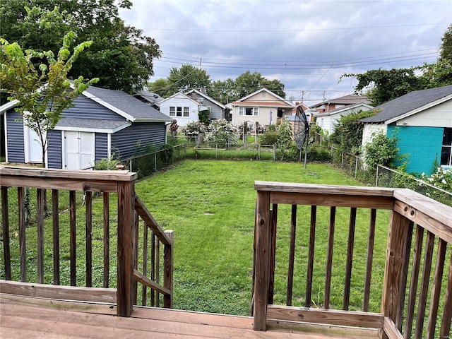 view of yard with a wooden deck and an outdoor structure