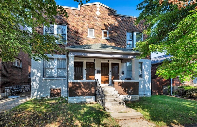 view of front of property with a front lawn and a porch