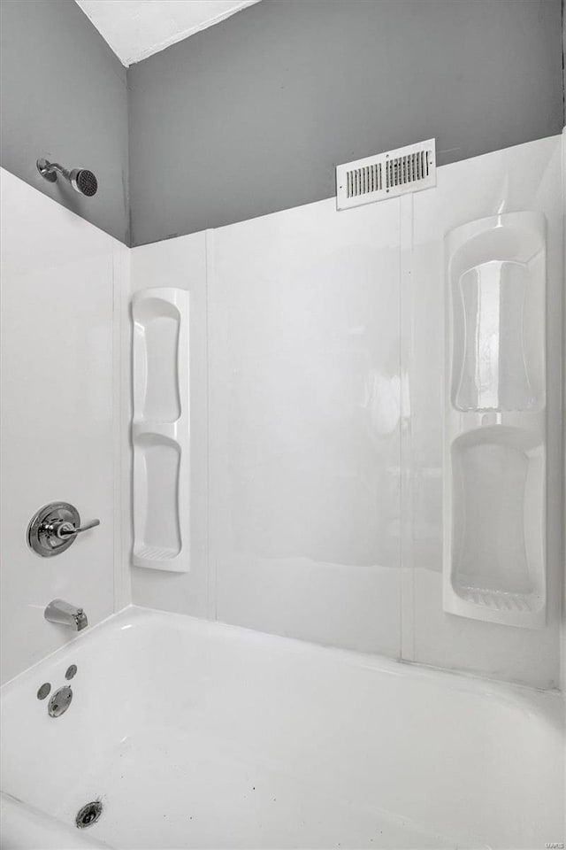 bathroom featuring  shower combination