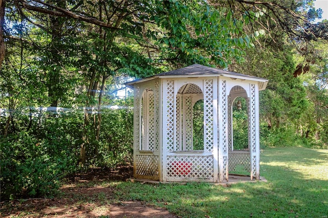 view of outdoor structure featuring a lawn