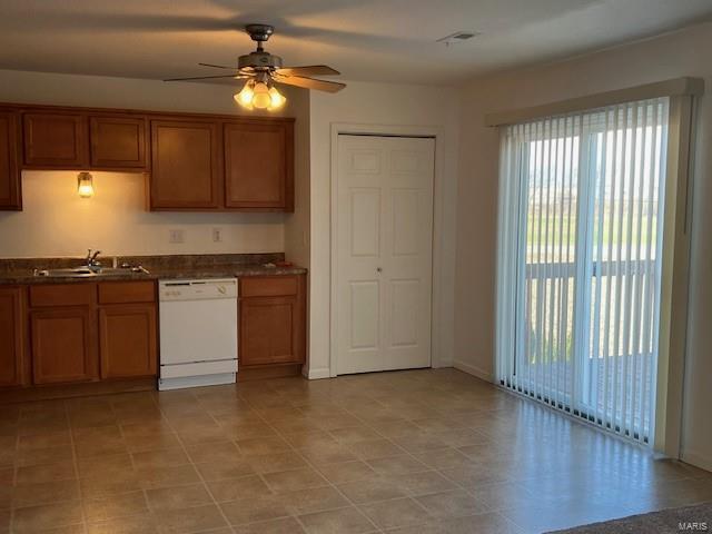 kitchen with white dishwasher, ceiling fan, and sink