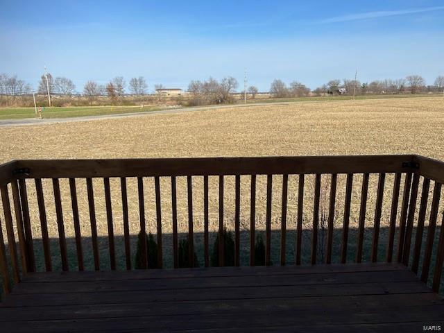 wooden terrace with a rural view