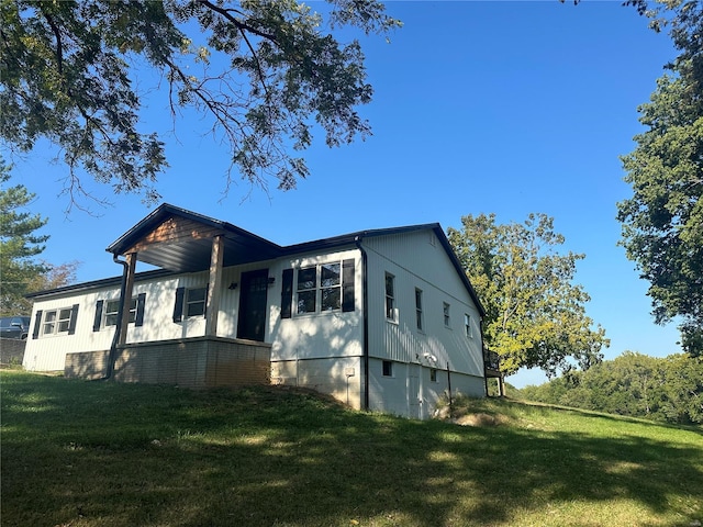 view of property exterior featuring a yard