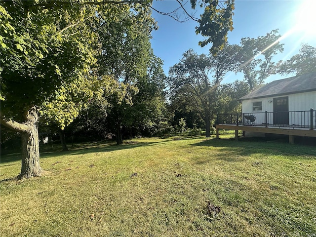 view of yard with a wooden deck