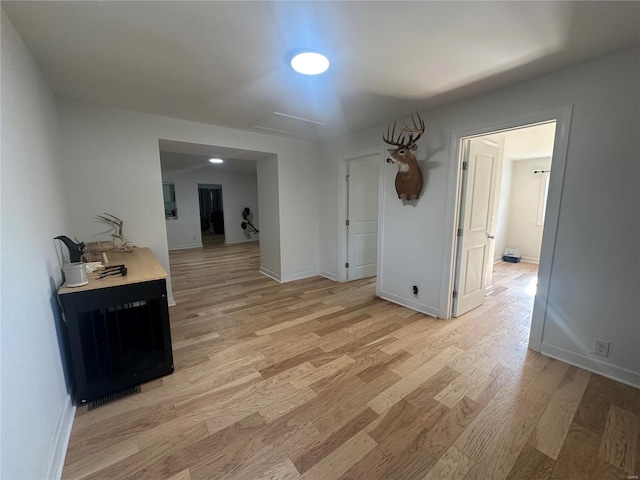 corridor featuring light hardwood / wood-style floors