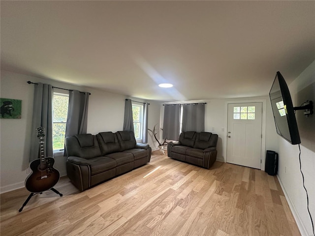 living room with light hardwood / wood-style flooring