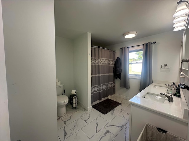 bathroom with tile patterned floors, curtained shower, vanity, and toilet