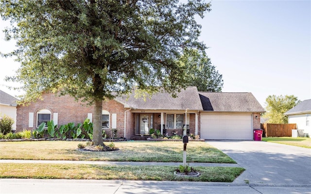 view of front of house with a garage and a front yard