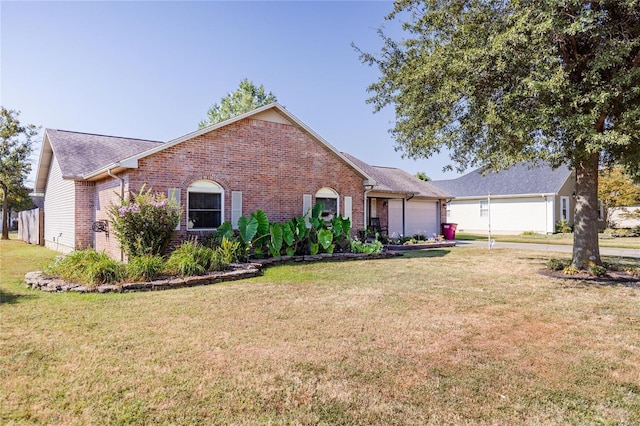 view of front of property with a garage and a front yard