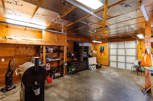 garage featuring wood walls