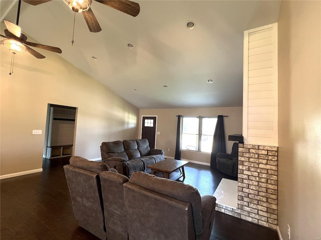 living room with ceiling fan, vaulted ceiling, and dark hardwood / wood-style floors