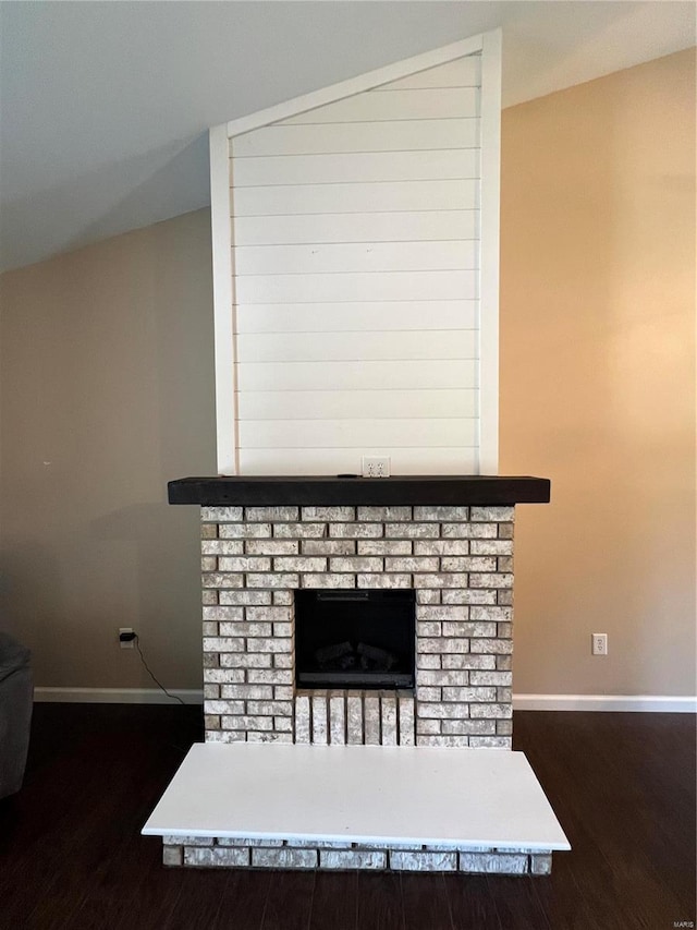 details with a brick fireplace and hardwood / wood-style floors