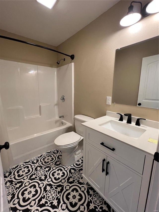 full bathroom with  shower combination, tile patterned floors, toilet, and vanity