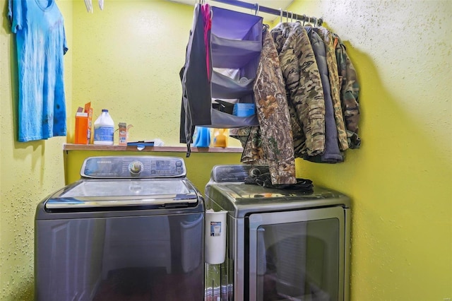 laundry room featuring washing machine and dryer