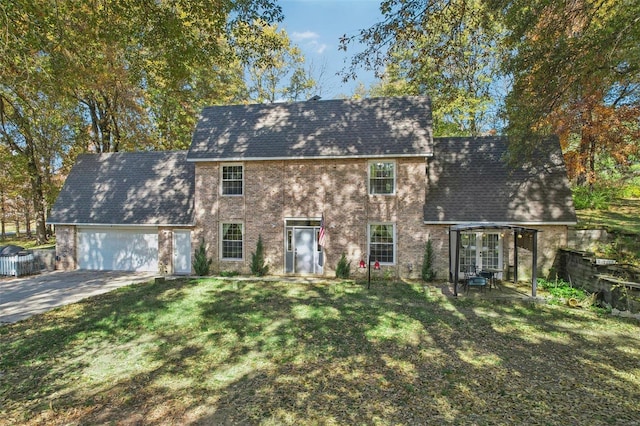 view of front of home with a garage and a front yard