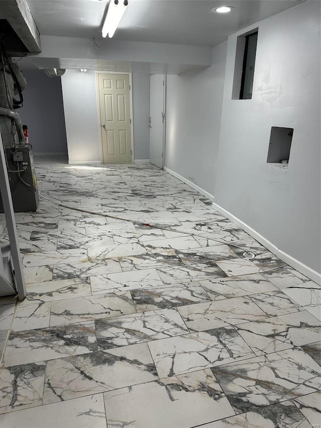 basement with electric panel and light tile patterned floors