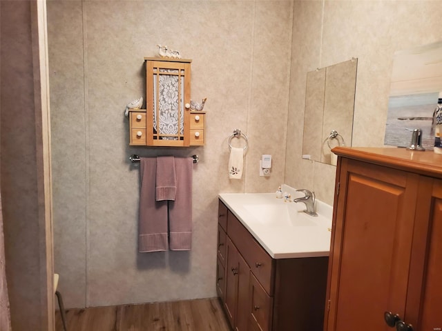 bathroom with vanity and hardwood / wood-style flooring