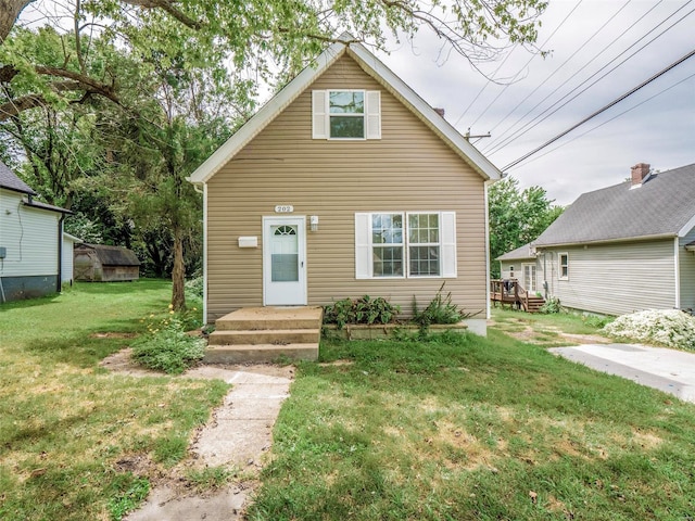 bungalow-style home featuring a front lawn