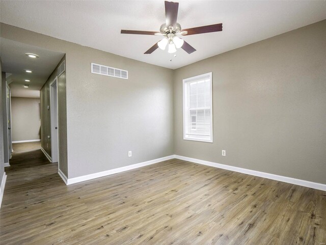 unfurnished room featuring ceiling fan and light wood-type flooring