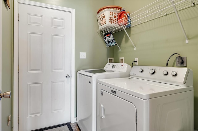 laundry area with washing machine and dryer