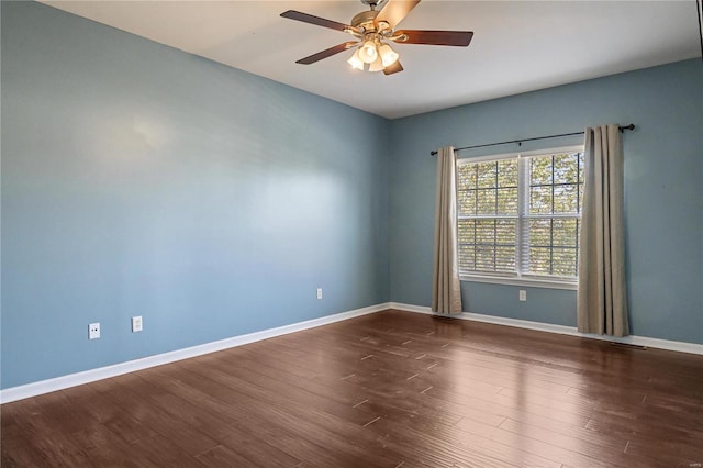 unfurnished room featuring ceiling fan and dark hardwood / wood-style floors