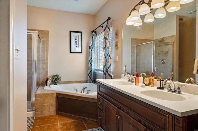 bathroom with vanity, shower with separate bathtub, and tile patterned flooring