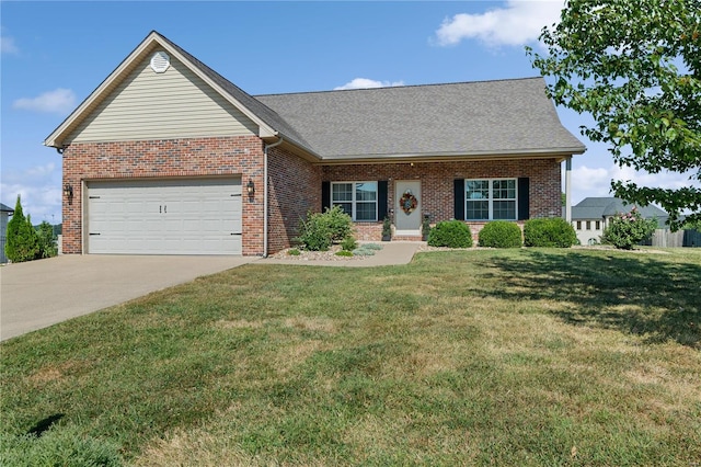 view of front of home featuring a front yard and a garage