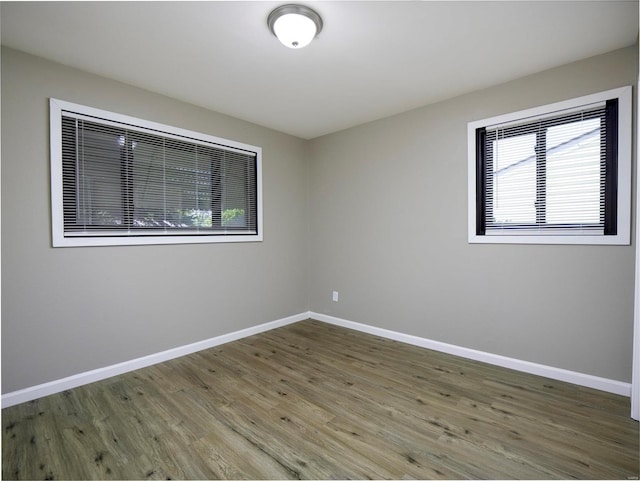 unfurnished room featuring wood-type flooring