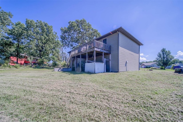 exterior space featuring a lawn and a wooden deck