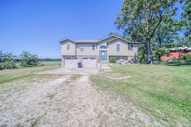 view of front of house with a garage and a front yard