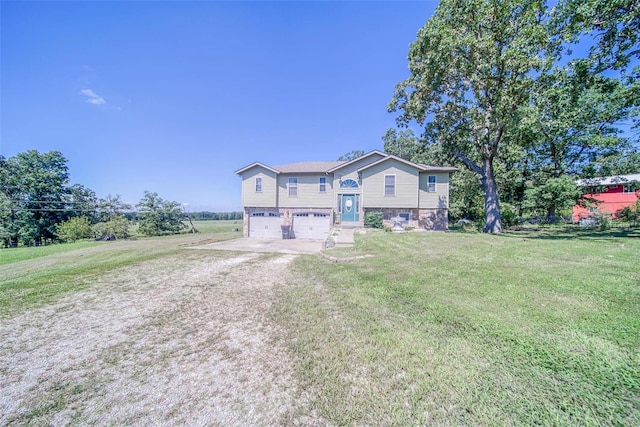 view of front of property featuring a garage and a front lawn