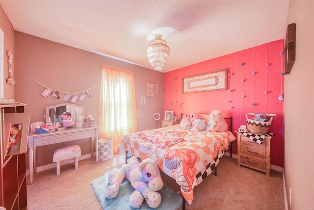 carpeted bedroom with a chandelier