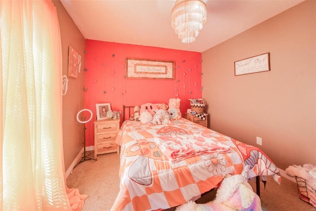 carpeted bedroom with a notable chandelier