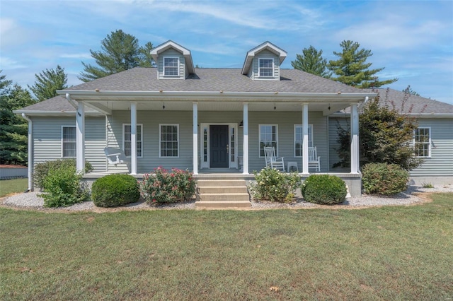 view of front of property with covered porch and a front lawn