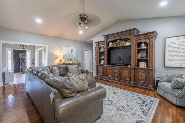 living room with hardwood / wood-style flooring, recessed lighting, a ceiling fan, and vaulted ceiling