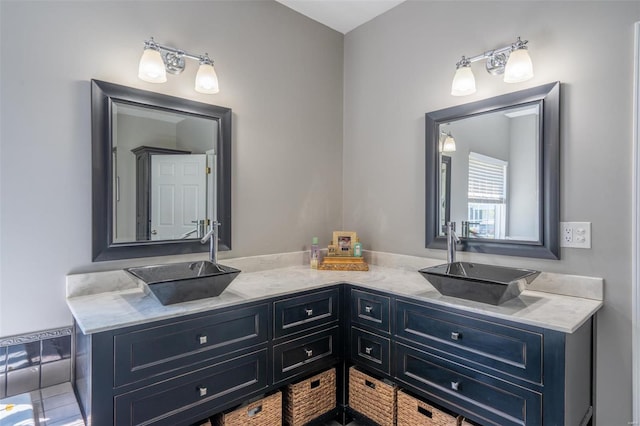 bathroom featuring double vanity and a sink