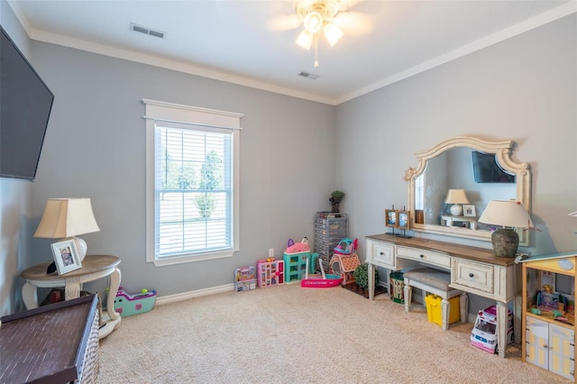 recreation room featuring crown molding, carpet, visible vents, and baseboards