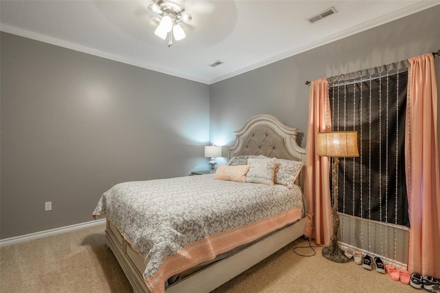 bedroom with visible vents, baseboards, crown molding, and carpet