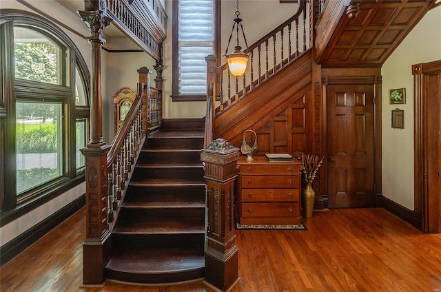 staircase with wood-type flooring