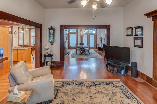 living room with hardwood / wood-style floors and ceiling fan