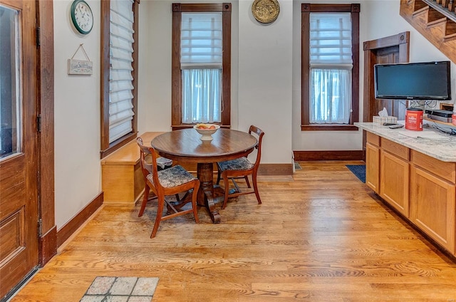 dining area with light hardwood / wood-style floors