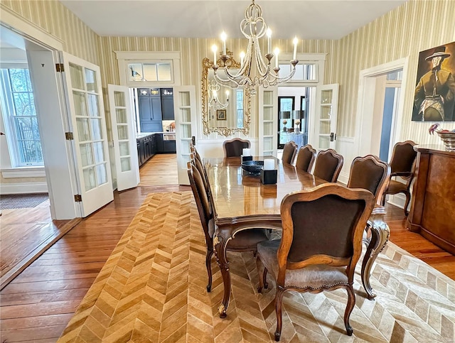 dining room featuring a chandelier and light hardwood / wood-style flooring