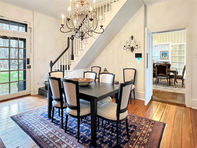 dining room featuring a notable chandelier and light hardwood / wood-style floors