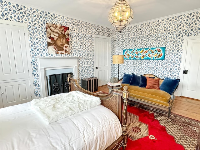 bedroom featuring crown molding and wood-type flooring