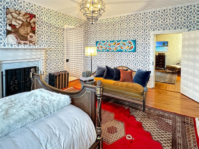 bedroom with crown molding and wood-type flooring