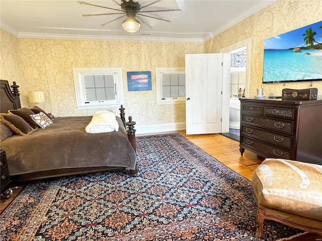 bedroom featuring crown molding, light hardwood / wood-style flooring, and ceiling fan