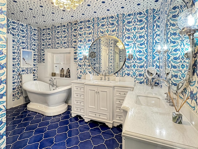 bathroom featuring tile patterned flooring, vanity, and a bathing tub